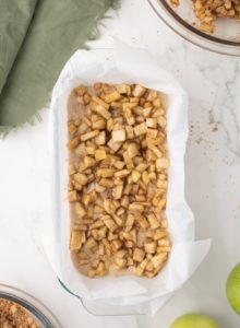 Apples spread on top of the bread batter