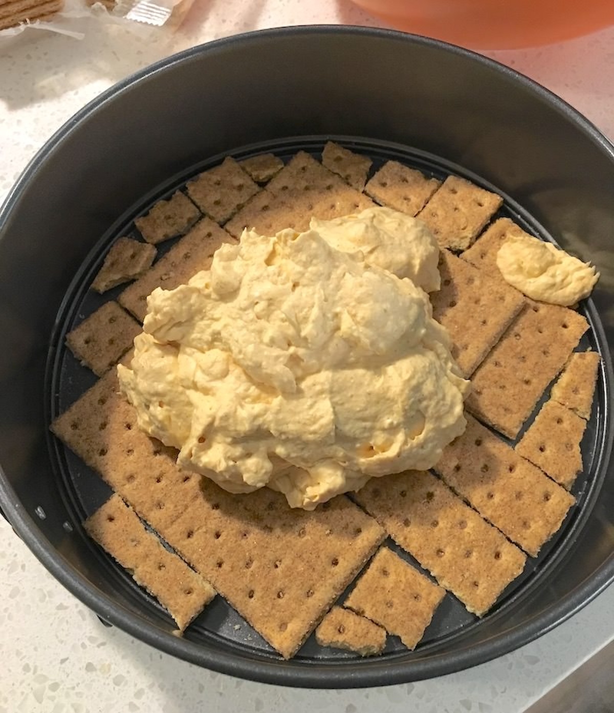 Layering the pumpkin on the graham crackers