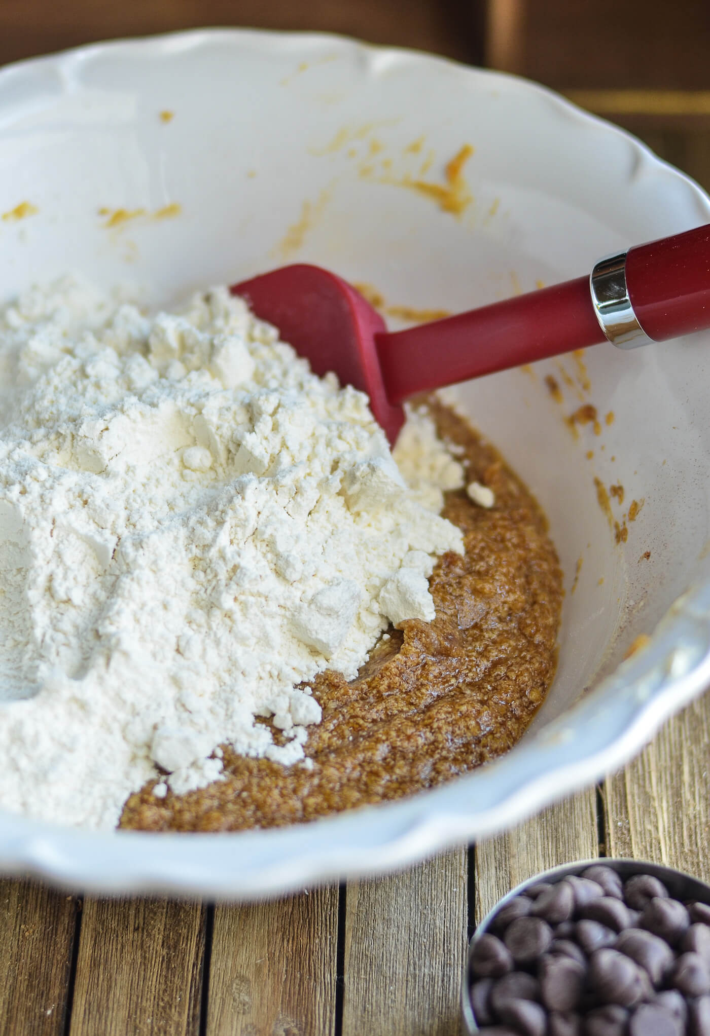 Mixing wet ingredients including pumpkin and dry ingredients