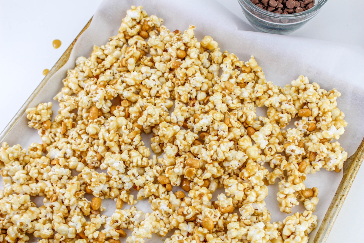 Spread the popcorn out on the baking sheet