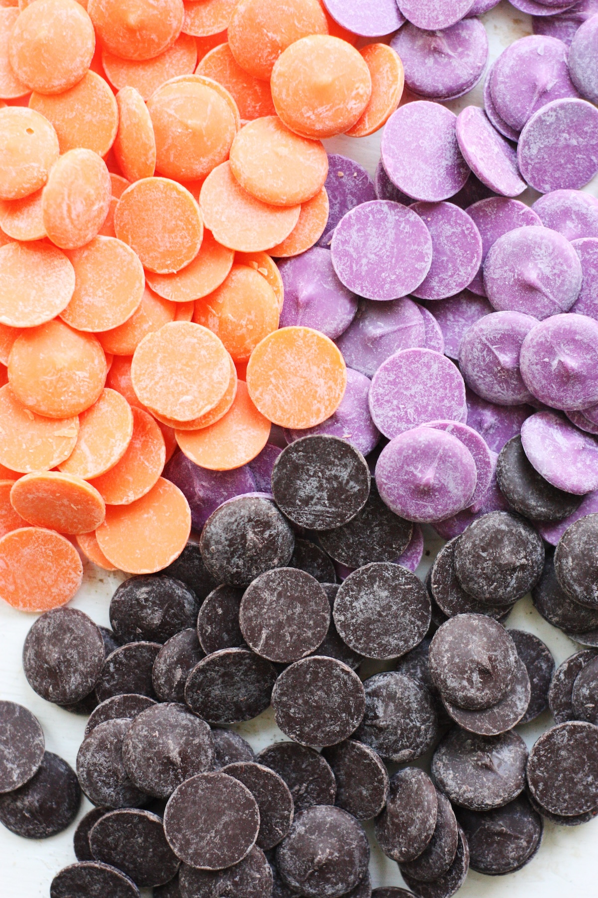 candy melts in orange, purple, and brown