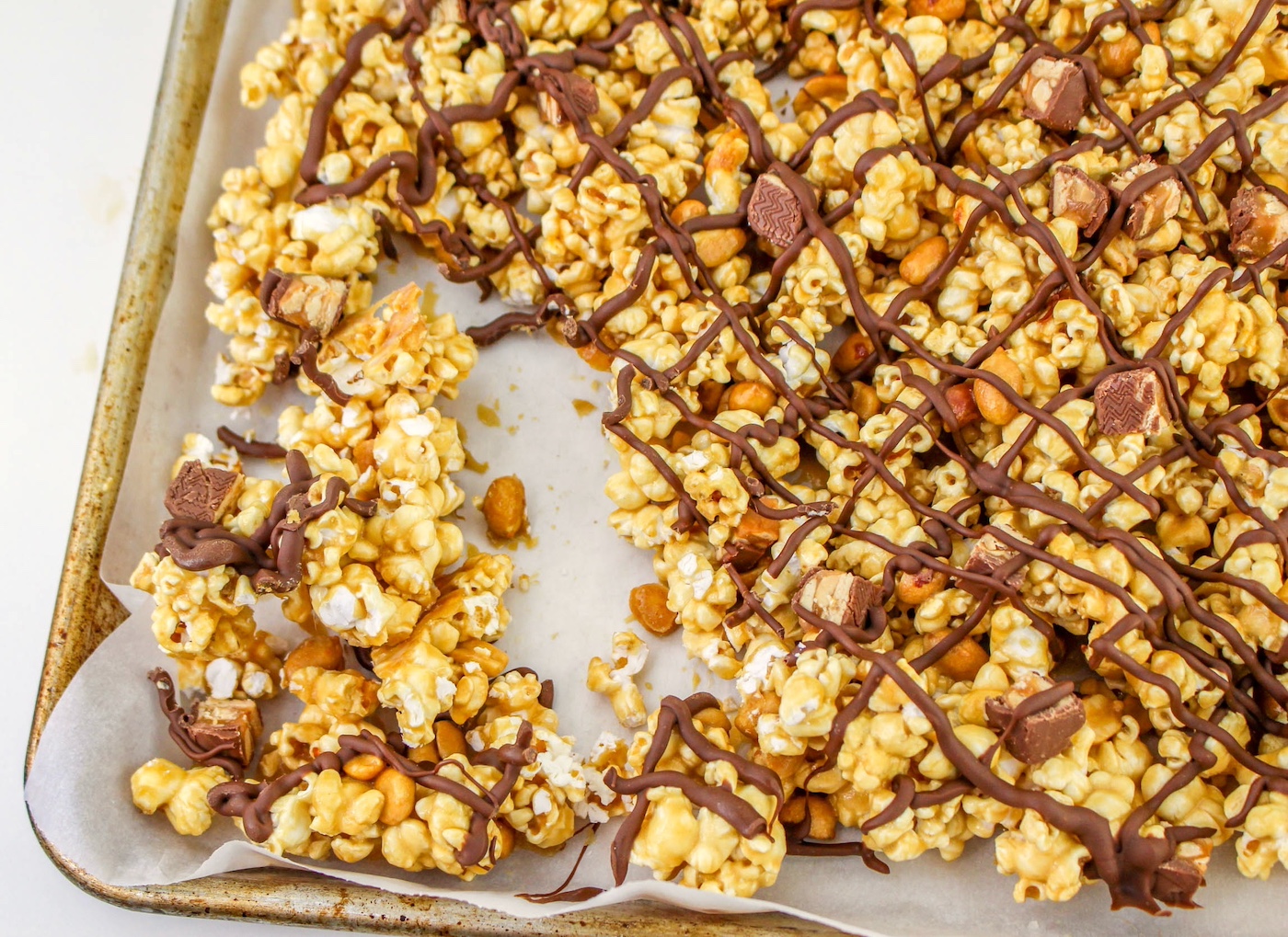 cookie sheet of snickers popcorn