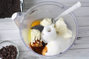 cream cheese, sugar, heavy whipping cream, vanilla and egg in the food processor bowl