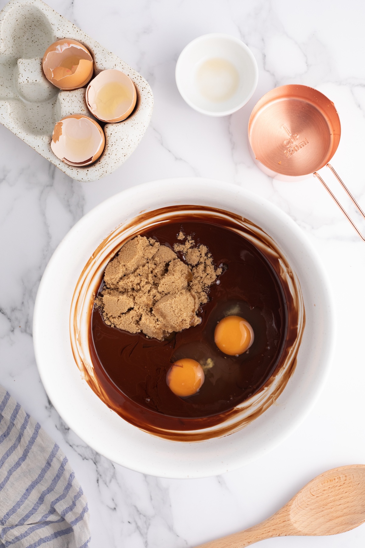 Brown sugar, eggs, and vanilla added to the chocolate mixture