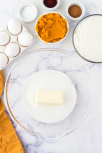 Butter and sugar together in a mixing bowl