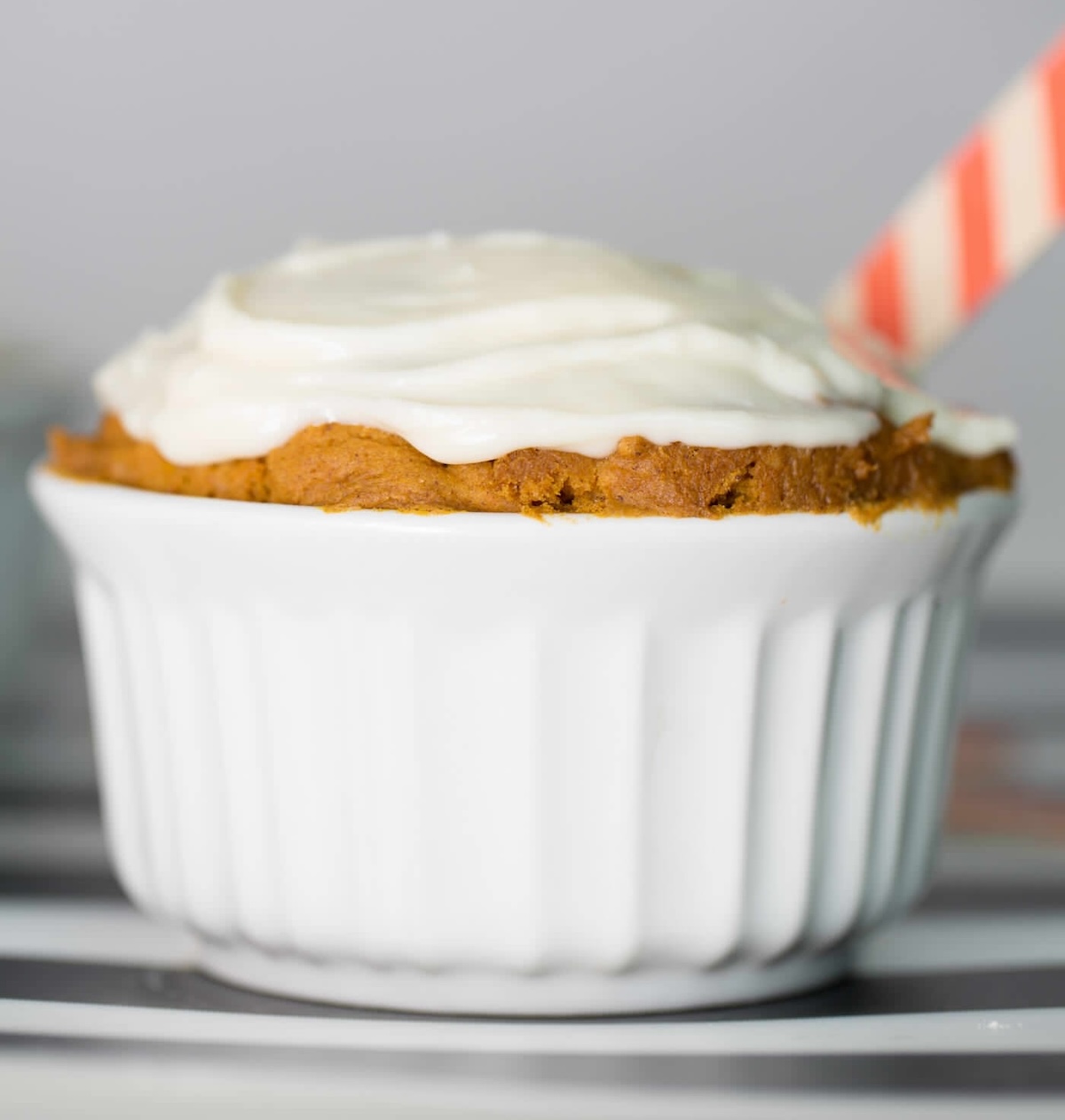 Make a pumpkin spice mug cake in a ramekin with frosting