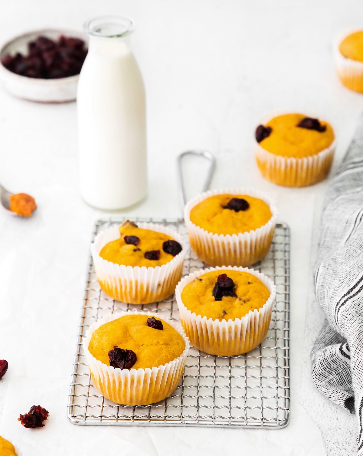 Pumpkin Cranberry Muffins on a rack