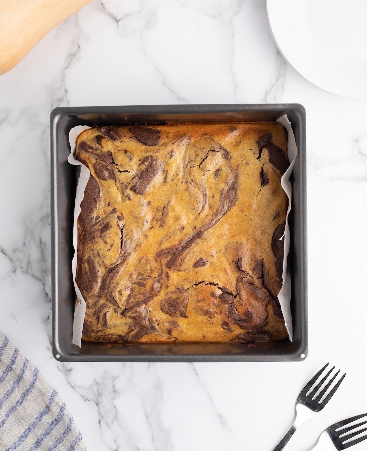 Pumpkin cheesecake brownie recipe in a pan