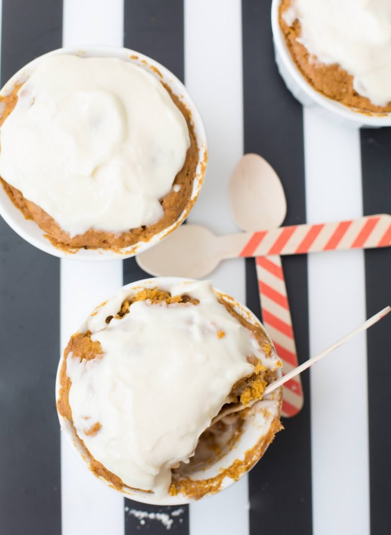 Pumpkin spice mug cakes in ramekins with decorative wooden spoons