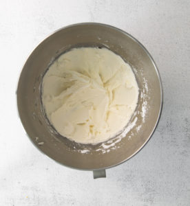 vanilla buttercream icing mixed in a bowl