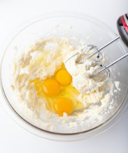 Adding lemon juice, zest, and eggs into the butter mixture