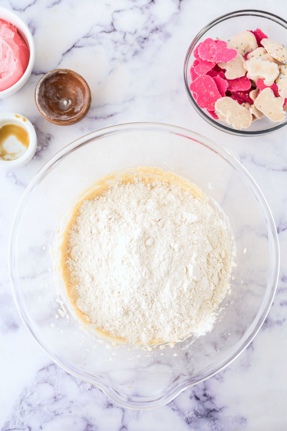 Baking powder, baking soda, and flour added to the batter