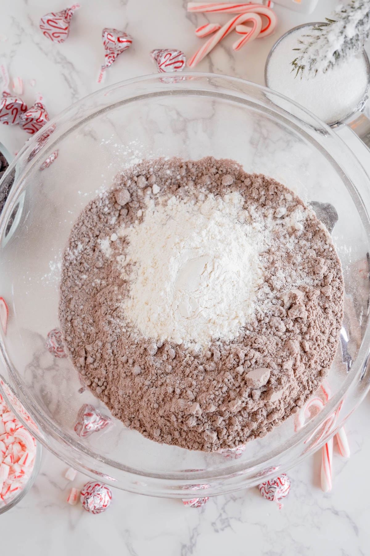 Brownie mix and flour in a glass bowl