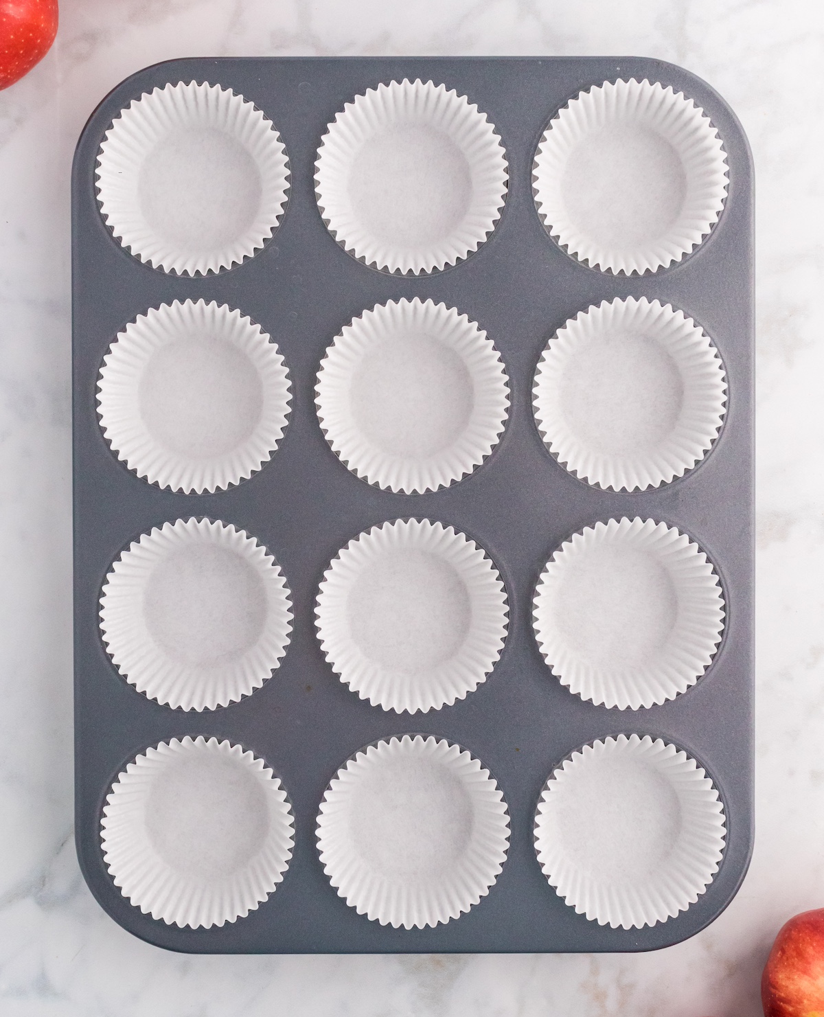 Muffin tin with white liners inserted