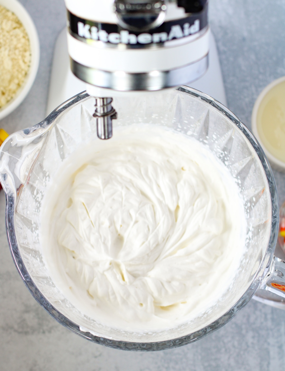 beating heavy cream and vanilla in a mixer