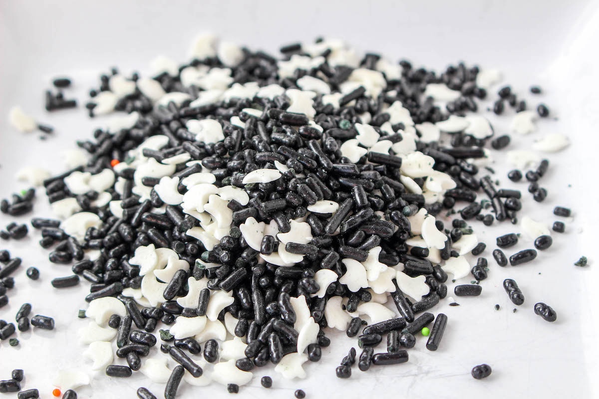 pile of black sprinkles and ghost sprinkles for Halloween