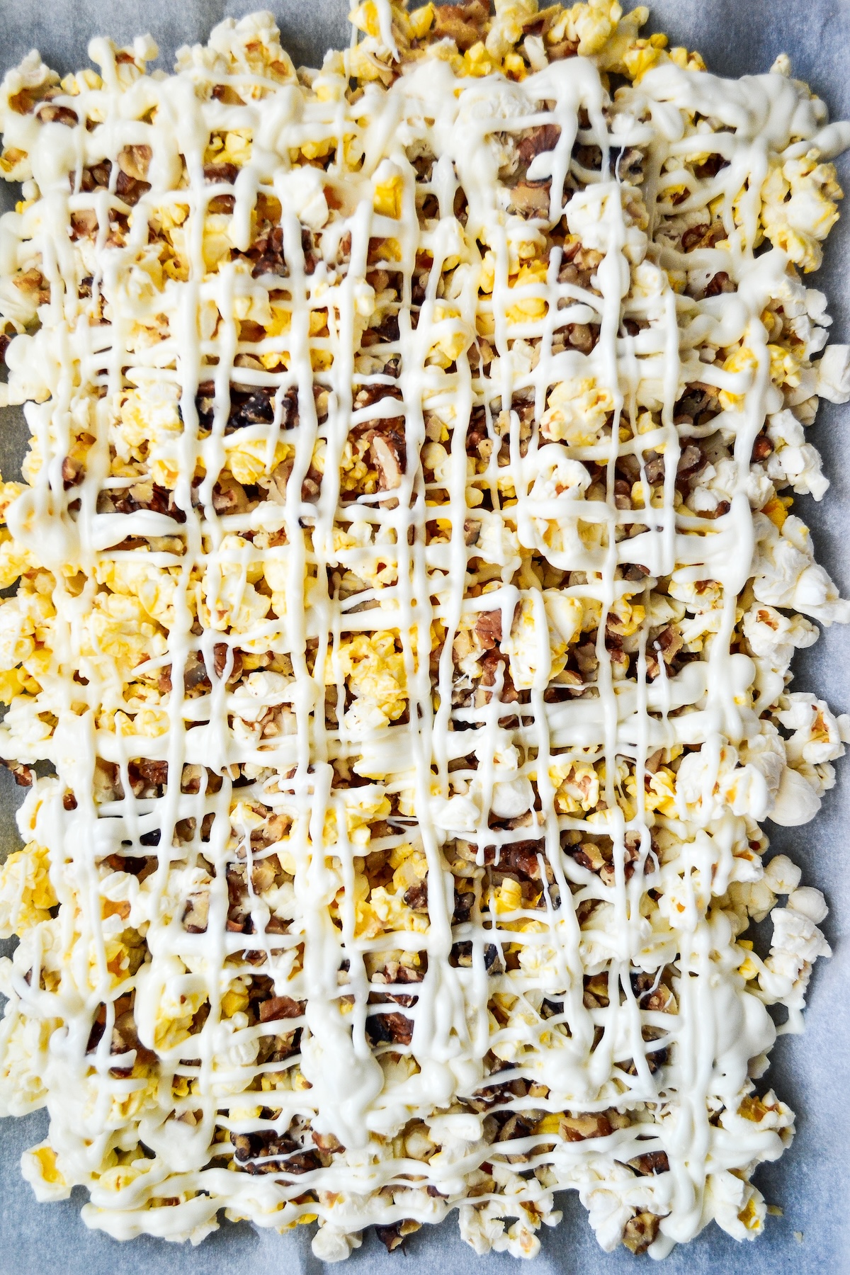white chocolate sprinkled over the popcorn
