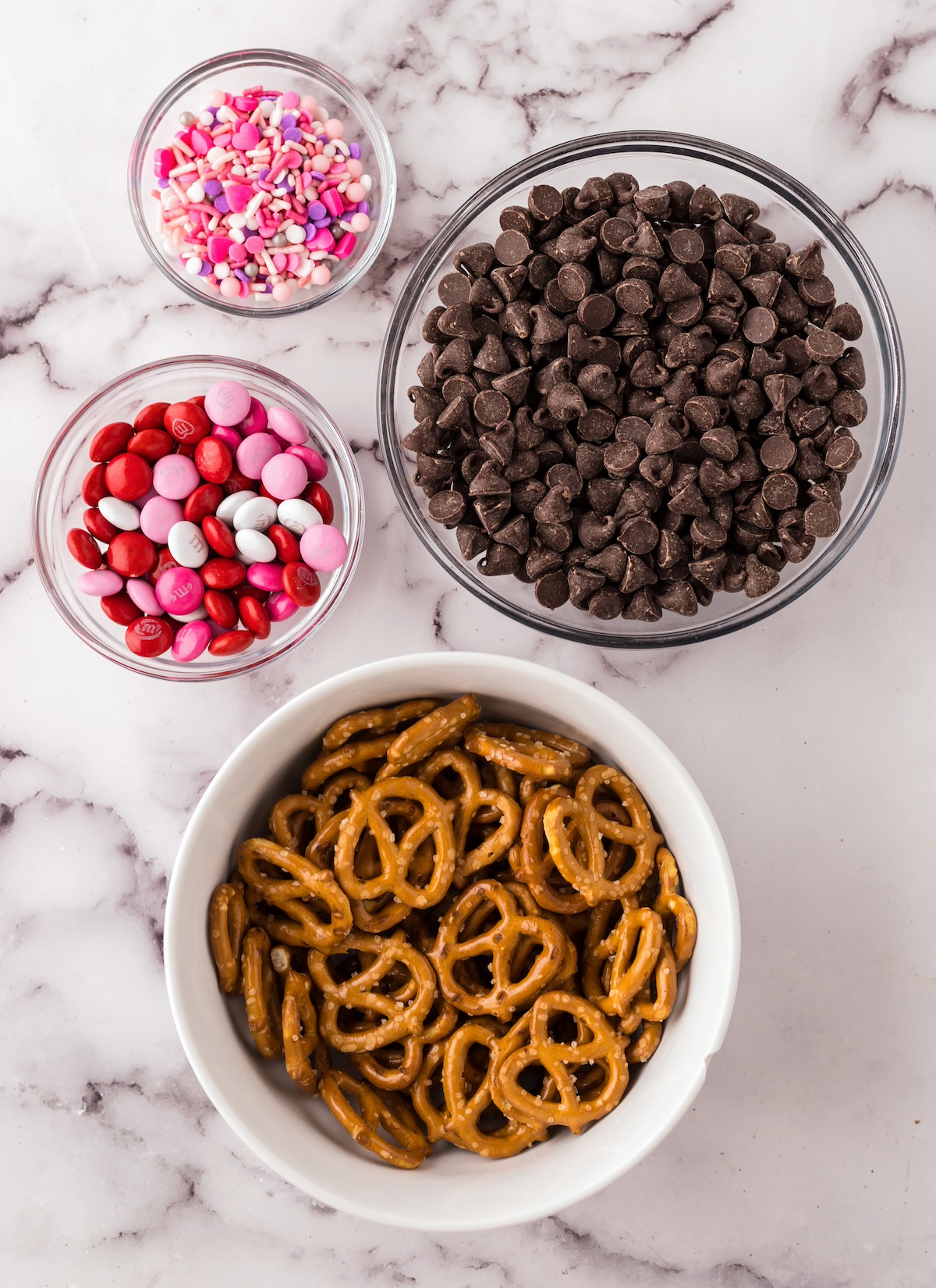 Pretzels, M&Ms, chocolate chips, and valentine's day sprinkles