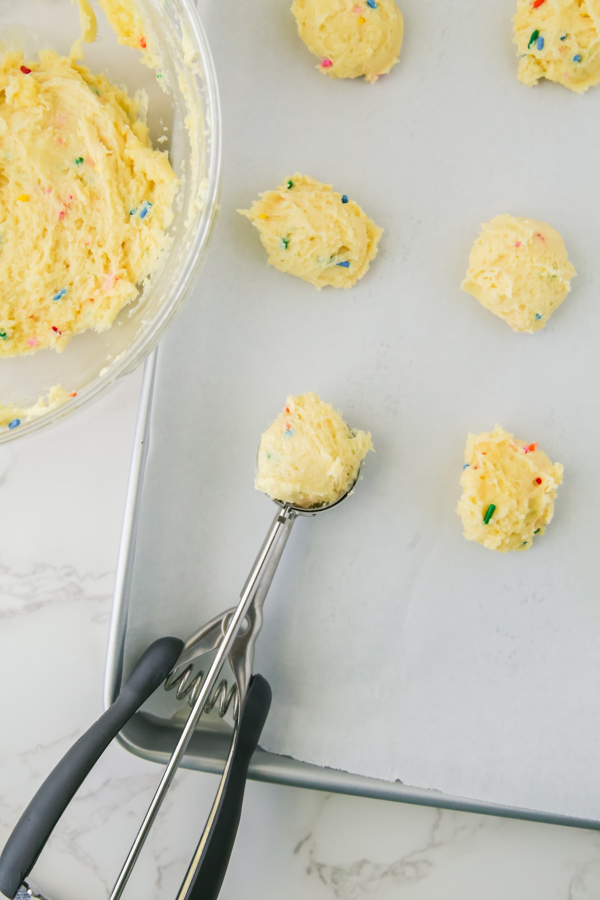 Use-a-cookie-scoop-to-add-the-cookie-balls-to-the-cookie-sheet