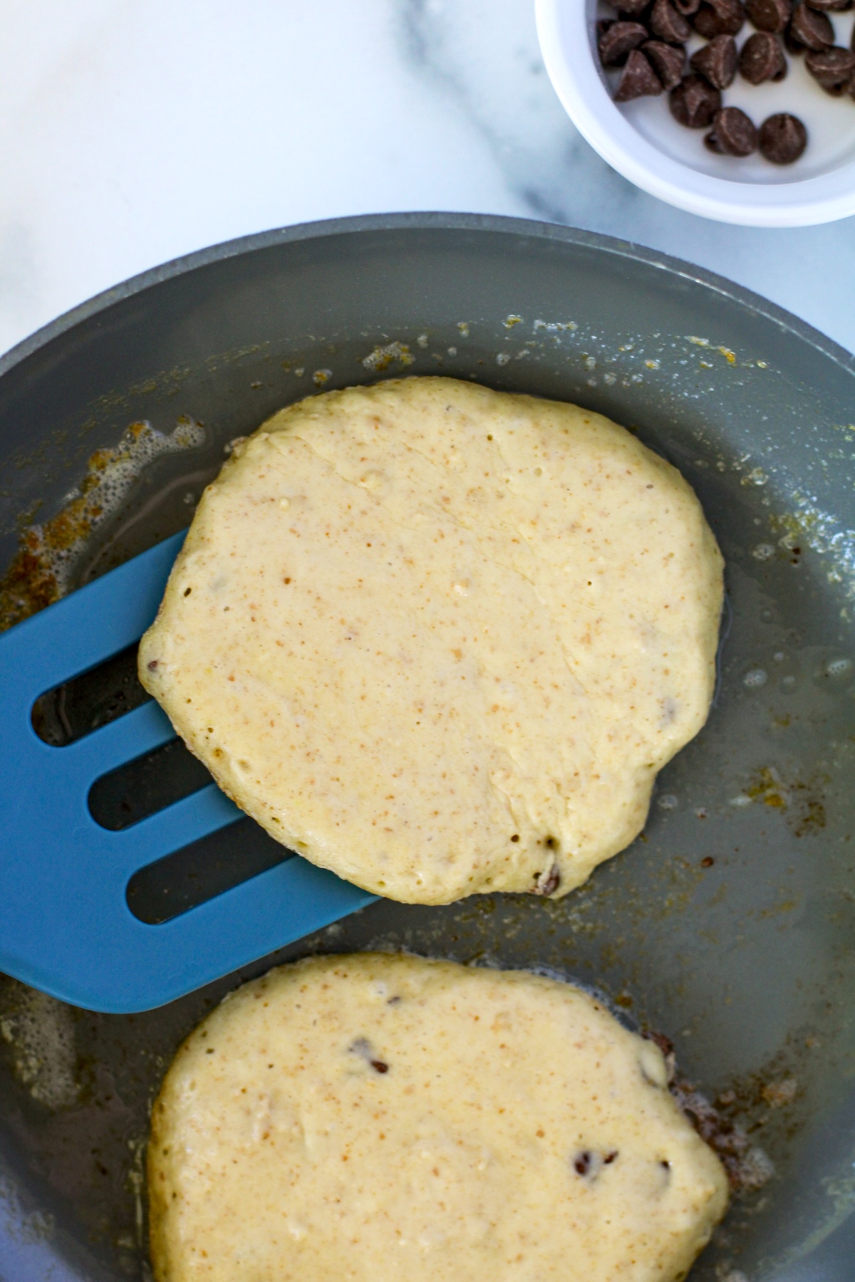 cooking the pancakes on a griddle