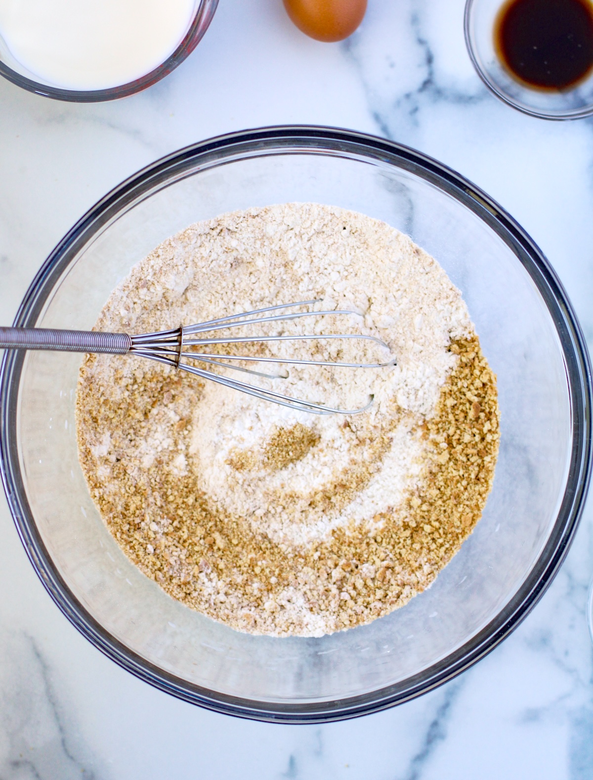 graham cracker crumbs, flour, baking powder, and brown sugar in a large glass bowl