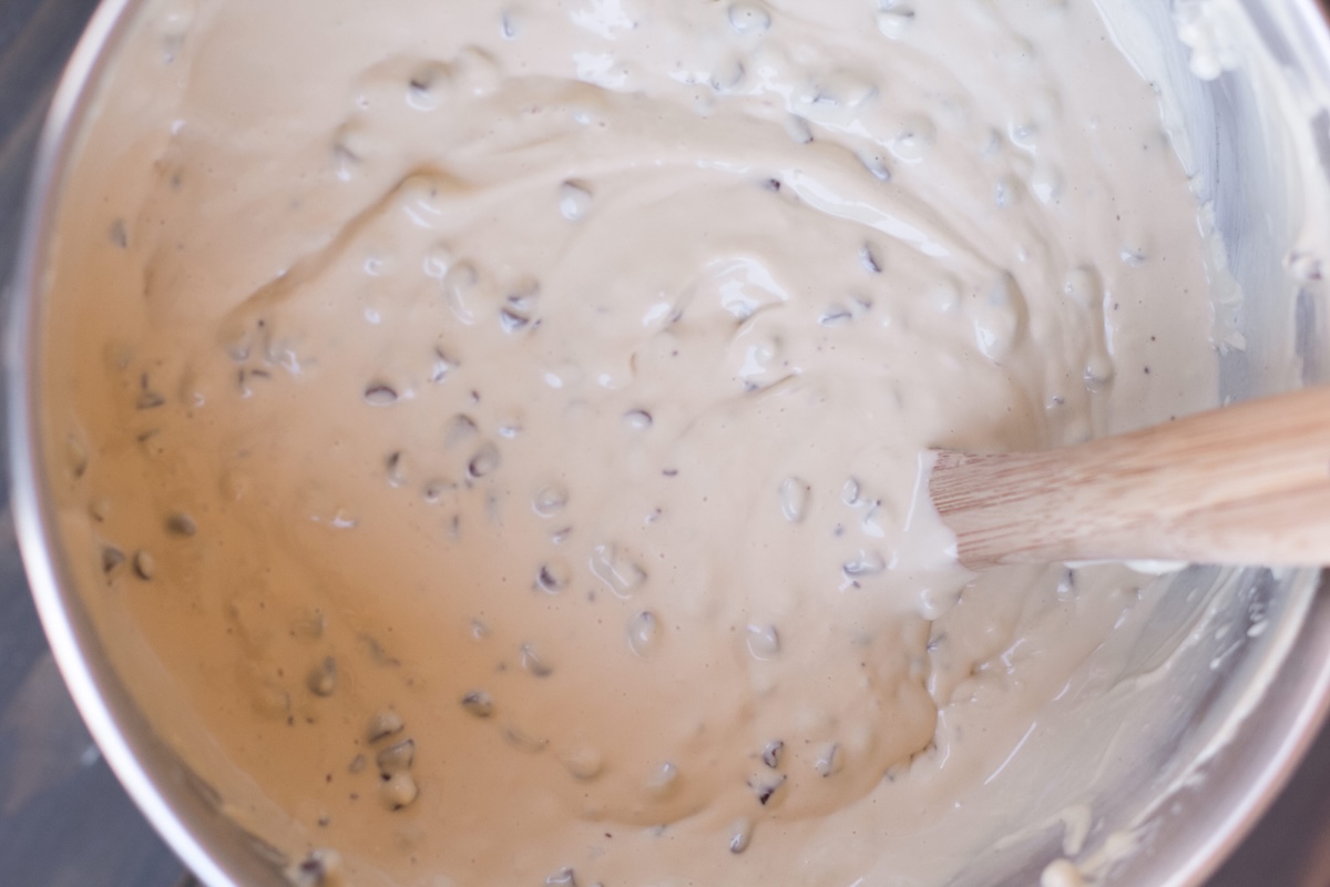 Stir in bag of chocolate chips. Add in the milk and vanilla and combine. Add the eggs and mix on low until just combined.