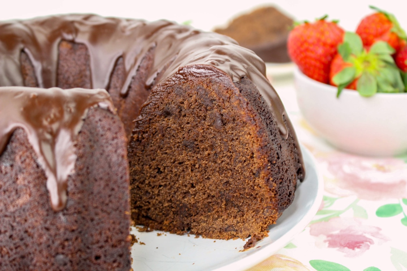 chocolate bundt cake with a piece cut out of it