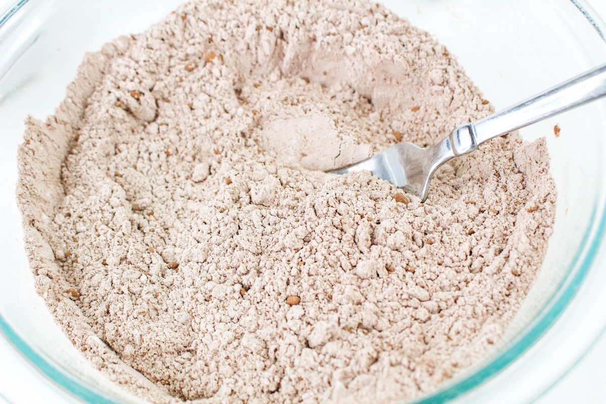 flour, cocoa powder, baking powder, baking soda, and salt whisked together in a bowl