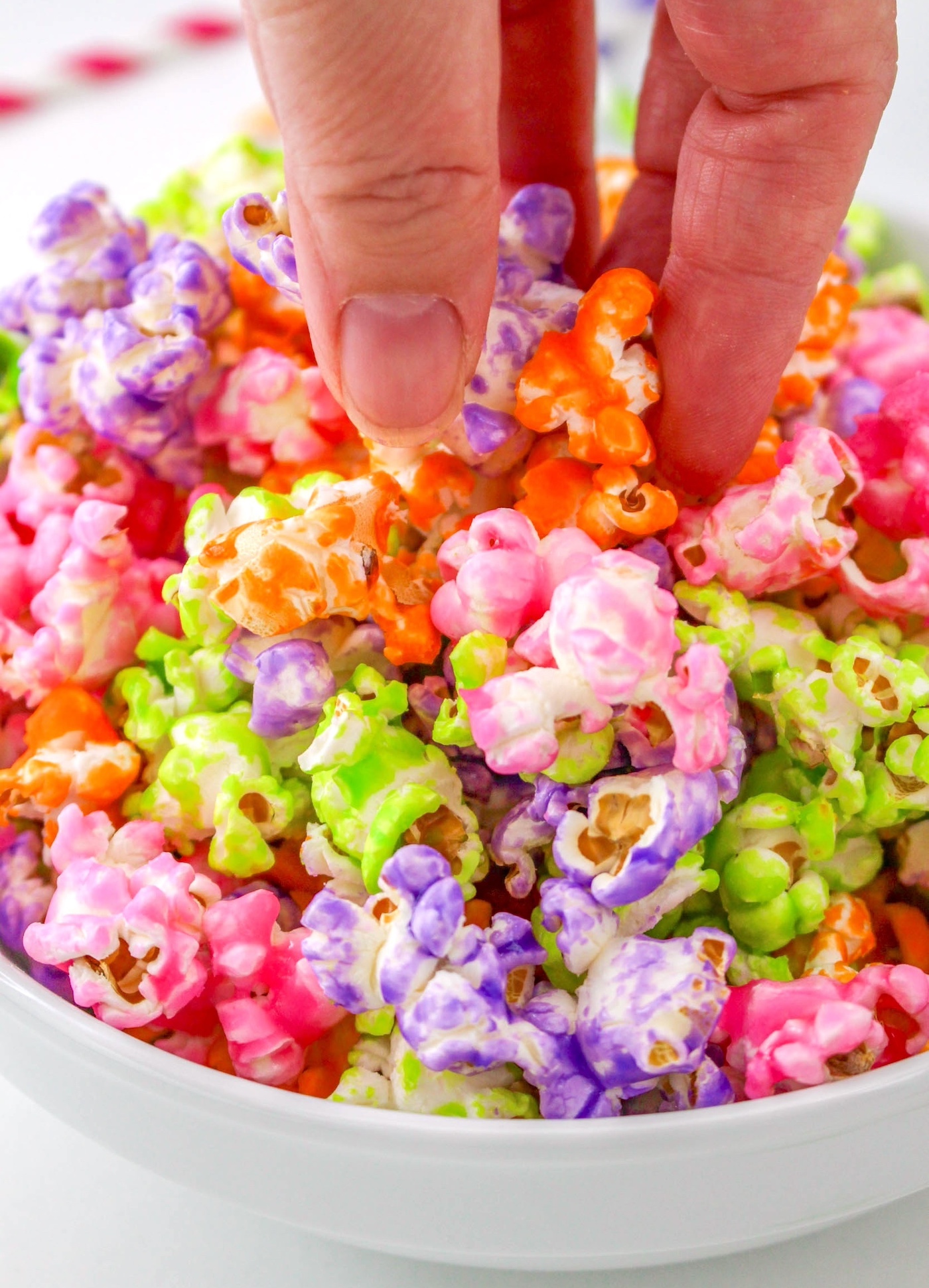 hand taking some candy popcorn